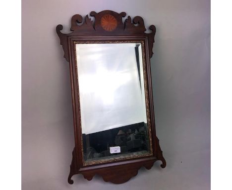 EDWARDIAN UPRIGHT BEVELLED WALL MIRROR, contained in a mahogany fretwork frame, 67cm long
