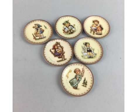 TWELVE GOEBEL HUMMEL PLATES, each depicting figures of children, each approximately 82mm diameter
