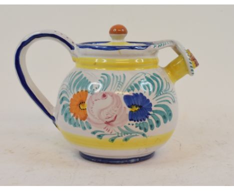 Fahrelnissa Zeid (Turkish, 1901-1991), a tin glazed teapot, decorated flowers and foliage, 14 cm high and an associated cover