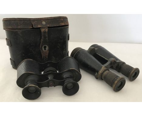 2 pairs of vintage binoculars. One cased. Uncased pair marked Lemaire Fabi Paris. 