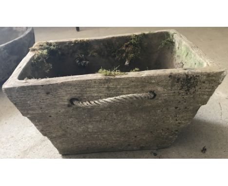 A rectangular shaped concrete garden planter with rope handles and wood effect design to sides.  Approx. 38.5cm x 27.5cm x 22