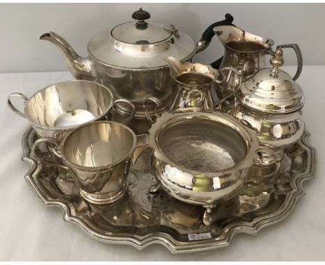 A small quantity of silver plate items. Comprising a tea tray, matching teapot, sugar bowl and milk jug, matching lidded pot 