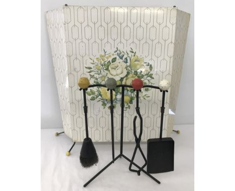 A 1950's - 60's retro metal folding firescreen with floral decoration. Together with an Atomic companion set. 