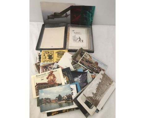 A quantity of vintage loose postcards together with a postcard album.  