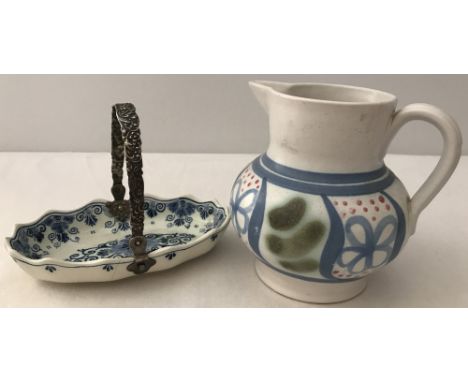 A delft ceramic bon bon dish with ornate silver handle. Together with a Buchan Portabello Scotland jug. Silver has continenta