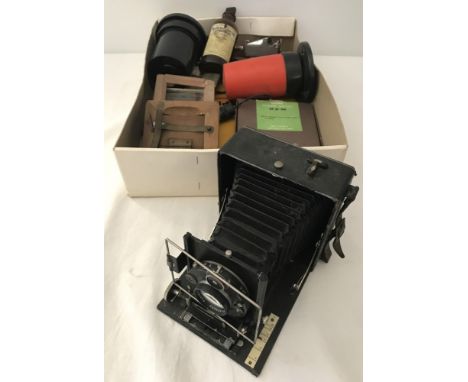 A box of assorted vintage photography equipment and accessories. To include boxed Ilford Darkroom Safelight, The Paterson Tan