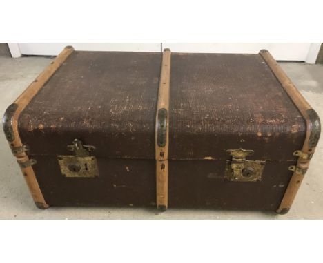 A vintage wooden banded travellers trunk.  Approx. 67 x 49 x 30cm.