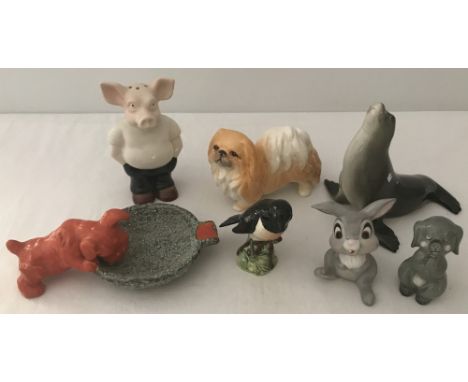 A small collection of ceramic animal figurines. To include Lomonosov seal, Beswick Stonechat , Sylvac Pekinese and a wade pig