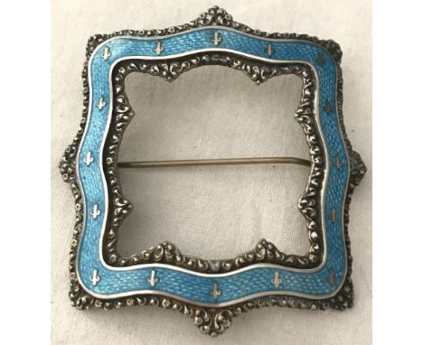 A vintage open square sterling silver and blue guilloche enamel brooch. Blue ribbon style guilloche enamel inlaid with small 