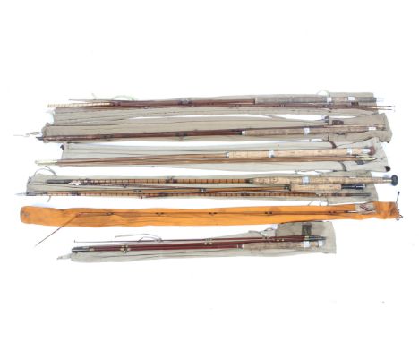 Seven vintage salmon and trout fly rods. Including 3-piece and 4-piece examples, complete with canvas bags. 