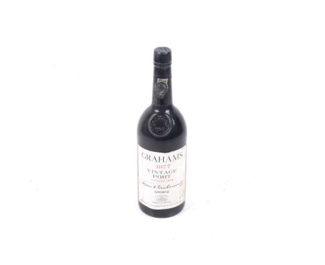 A bottle of Grahams 1977 vintage port. Bottled 1979, 75cl, no vol shown. 