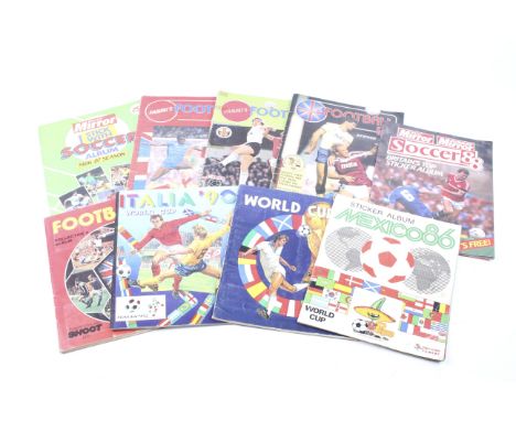 A collection of nine Panini sticker albums. Mainly 1980s including 1986 world cup, most are well stocked with English first d