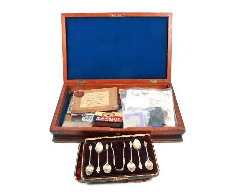 Set of weighted Apostle spoons, with sugar tongs, cased; small collection of coins; stamp; bronze medal; and other artefacts,