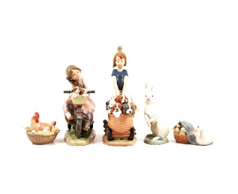 Five Lladro and Nao figurines, to include Lladro Travelling In Style 5680; Litter of Fun 5364; Hippity Hop 5886; Ducklings 48