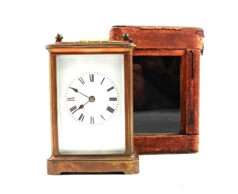 Brass cased carriage clock, rectangular enamelled dial, platform escapement, movement striking on a bell, 15cm, in a leather 