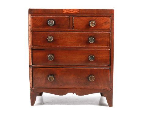 Victorian mahogany apprentice chest of drawers, top with oval shell inlay, two short and three long graduating drawers, brack