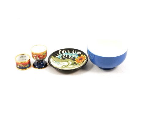 A Moorcroft 2007 Collector's Club 11.5cm pin tray, boxed; a Moorcroft enamel egg cup and napkin ring in lined presentation bo