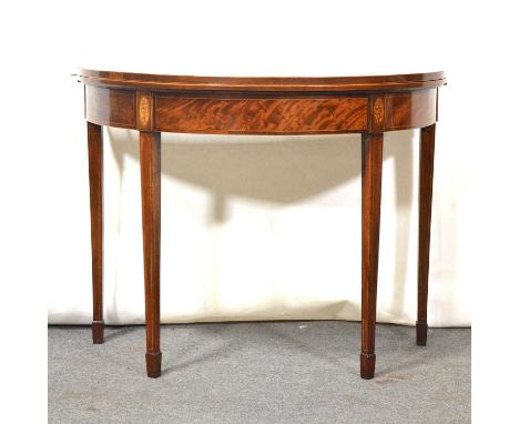 George III mahogany foldover card table, demi lune, the top with crossbanding and stringing, baize lined interior, frieze wit