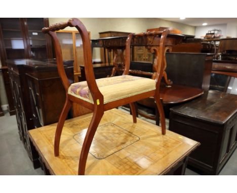 An Edwardian walnut piano stool, on splayed supports