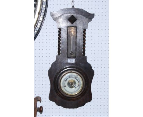 An early 20th century anaeroid barometer, on an oak backboard