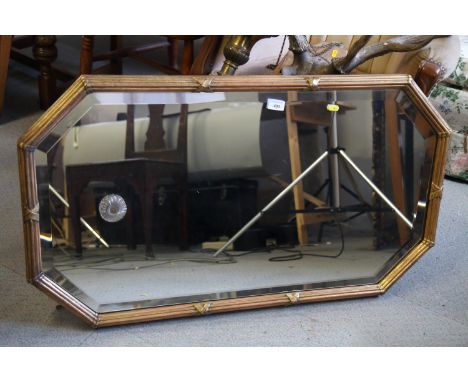 An Edwardian fillet and reed framed wall mirror with cut corners plate, 20" x 37"
