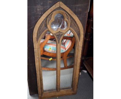 A stone effect lancet framed mirror, 32" high
