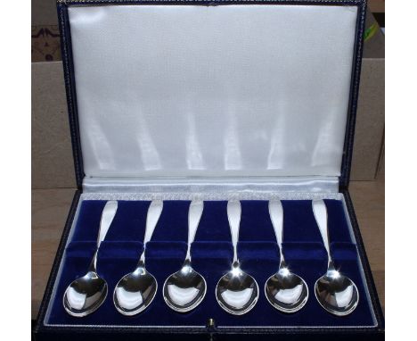 A cased set of six teaspoons, a number of other silver spoons, etc, a silver napkin ring, two silver bangles, two silver thim