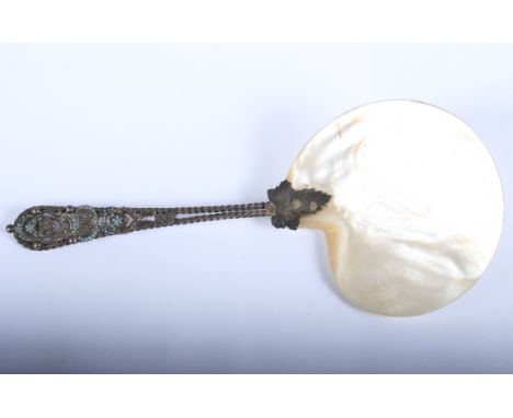 A silver gilt, enamel and mother-of-pearl serving spoon, stamped "Sterling", and a silver plated crumb scoop