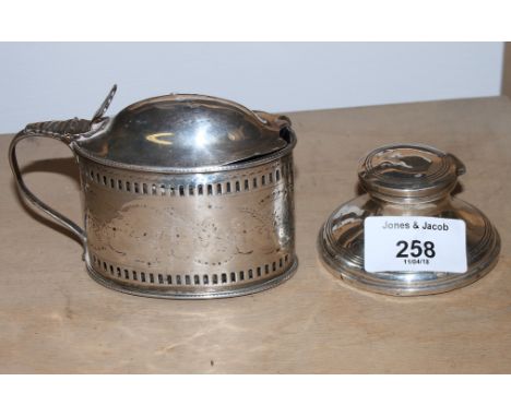 A Georgian silver lidded mustard with bright cut engraving, John Wall, London 1825, and a hallmarked silver capstan inkwell