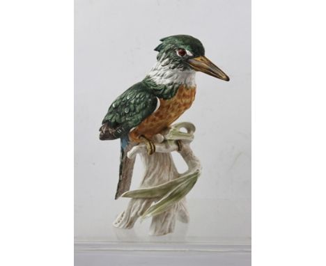A GOEBEL MODEL OF THE EUROPEAN KINGFISHER, perched on a willow branch, decorated in polychrome, dated 1970, no. CV116, signed