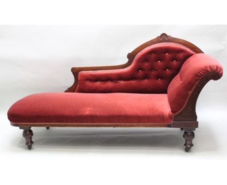 A LATE VICTORIAN MAHOGANY SHOW WOOD FRAMED SINGLE END CHAISE LONGUE having chip carved decoration includes anthemion, rust re