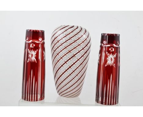 A MID 20TH CENTURY VENETIAN ART GLASS VASE with spiralling red and white bands, 23cm high together with a PAIR OF CUT RUBY FL