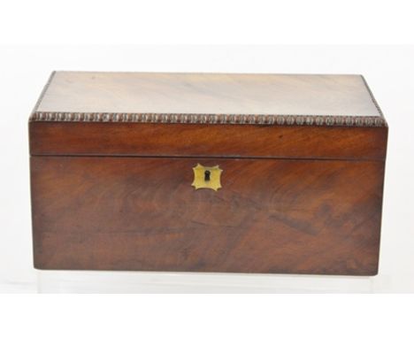 AN EARLY 19TH CENTURY CASKET FORMED TEA CADDY with bead edge lift-up top and remains of fitted interior, 15cm x 31cm 