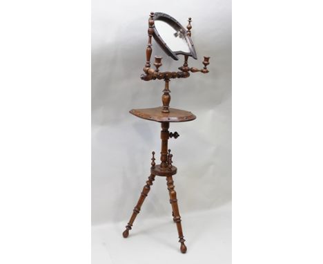 A LATE 19TH CENTURY OAK VANITY STAND, having novelty carved horseshoe framed adjustable mirrored top, on bobbin turned suppor