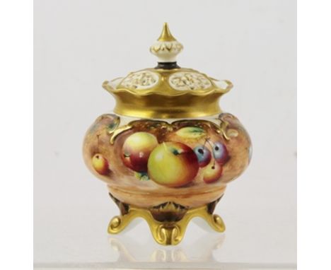 FRANK ROBERTS A ROYAL WORCESTER BONE CHINA LIDDED POT POURRI, having detachable pierced lid, gilded rim and belly painted wit