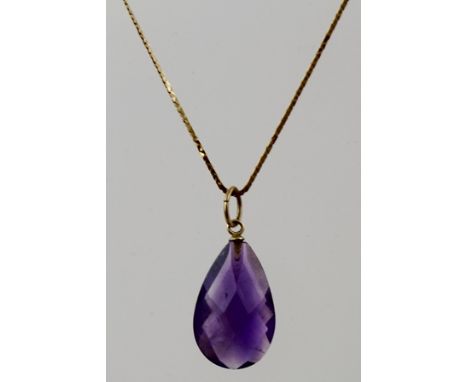 A SINGLE STONE AMETHYST ON CHAIN, having a pear cut stone on fancy gold coloured metal S-link chain 