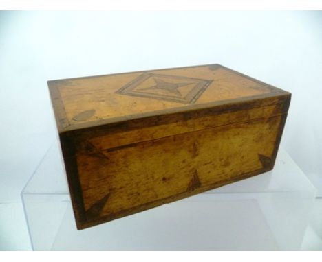 A 19TH CENTURY INLAID SATINWOOD TEA CADDY having hinged cover opening to reveal two inner compartments, 24cm wide 