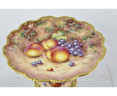JOHN FREEMAN A ROYAL WORCESTER BONE CHINA ELEVATED DISH TAZZA, having wavy gadroon gilt rim painted with peaches, cherries an