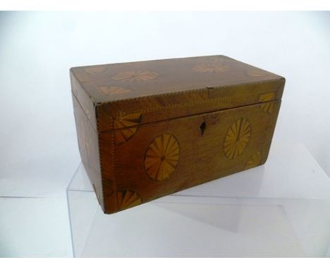 A 19TH CENTURY MAHOGANY TEA CADDY, fan patera inlaid, the hinged cover opening to reveal three inner compartments, 23cm wide 