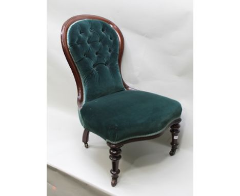 A VICTORIAN MAHOGANY SHOW WOOD FRAMED SALON CHAIR having serpentine fronted seat, seagreen button back velvet upholstery, on 