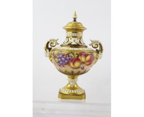 JOHN FREEMAN A ROYAL WORCESTER BONE CHINA PEDESTAL VASE, having detachable lid with finial, moulded richly gilded body with t