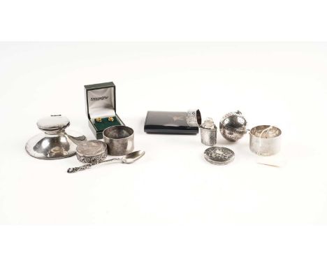 A selection of silver items, including: a capstan form inkwell by Asprey, London; napkin rings; white metal boxes; a Japanese