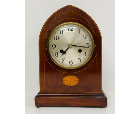 A Domed eight day, mahogany mantle clock with fruitwood inlay.