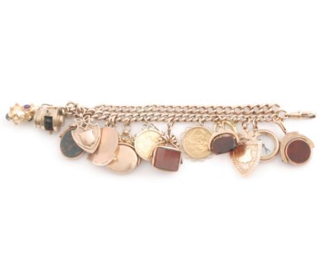 A 9ct rose gold Albert chain converted to a double link charm bracelet with fifteen assorted charms attached to include two l