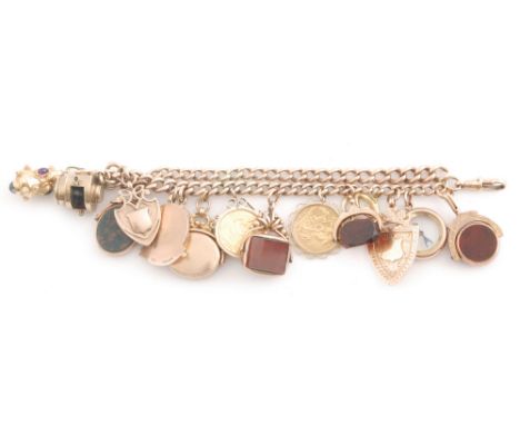 A 9ct rose gold Albert chain converted to a double link charm bracelet with fifteen assorted charms attached to include two l