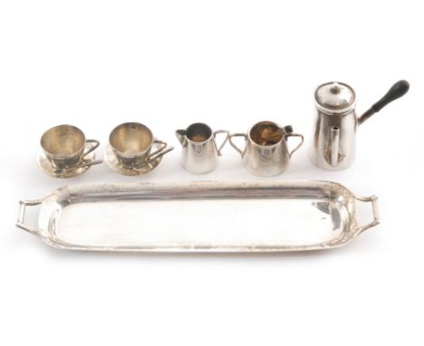 A hallmarked silver miniature three piece tea set with two conforming cups and saucers, two tea spoon and sugar tongs all to 