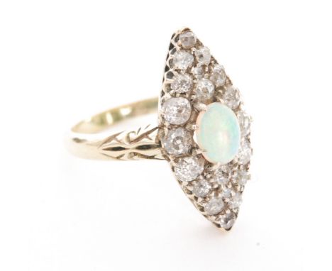 An early 20th Century opal and diamond cluster ring, central oval cabochon cut opal within an eighteen old cut diamond surrou