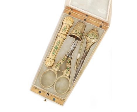 A 19th Century French etui, the foliate decorated mother of pearl case opening to fitted interior with five sewing implements