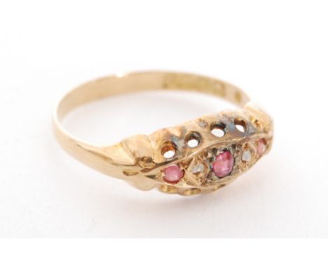 An 18ct hallmarked ruby and diamond five stone boat shaped ring, ring size M, Birmingham 1917