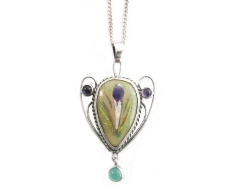 A George Hunt enamel pendant in the Arts and Crafts style, the central inverted teardrop panel enamel decorated with a crocus